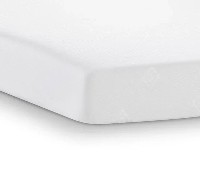 White foam mattress corner with textured cover shown in close-up view