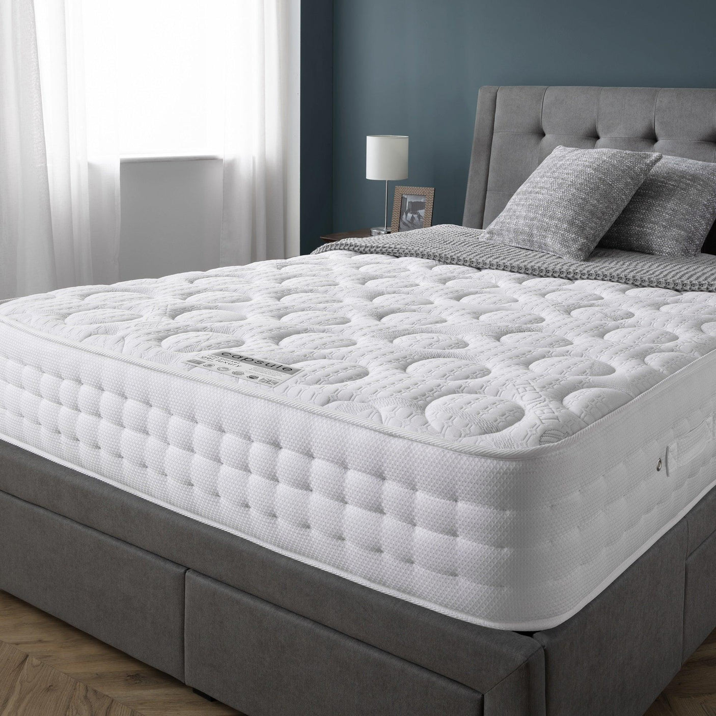 Capsule Gel Luxury Mattress 150cm on upholstered grey bed in modern bedroom setting