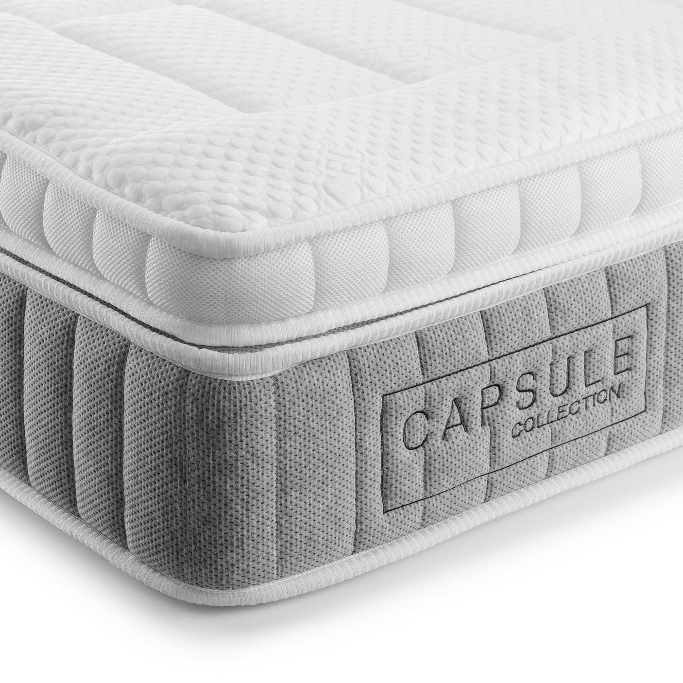 135cm mattress closeup showing quilted white top and grey panel with Capsule Collection label