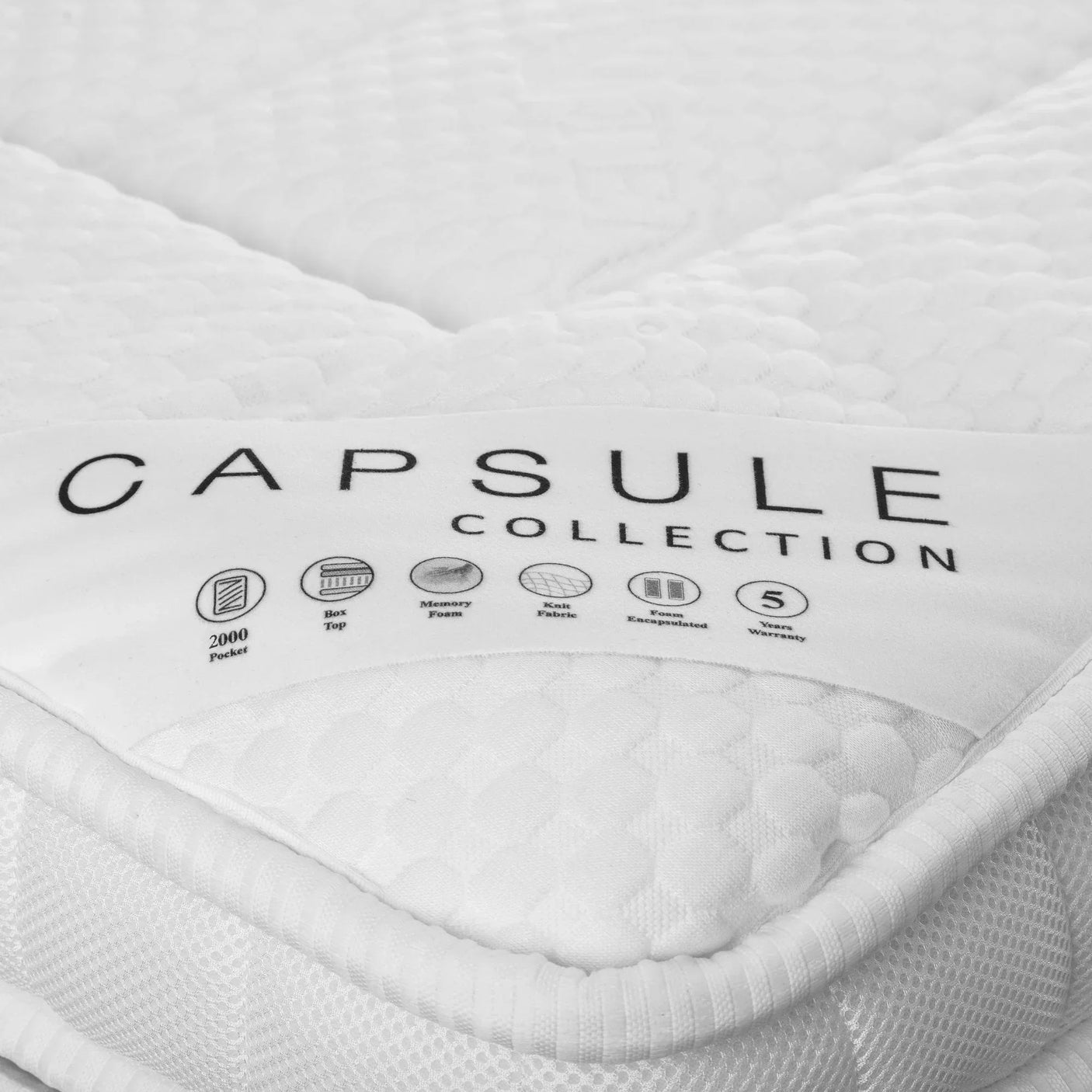 Close-up of Capsule Collection pocket spring mattress with memory foam and box top corner detail