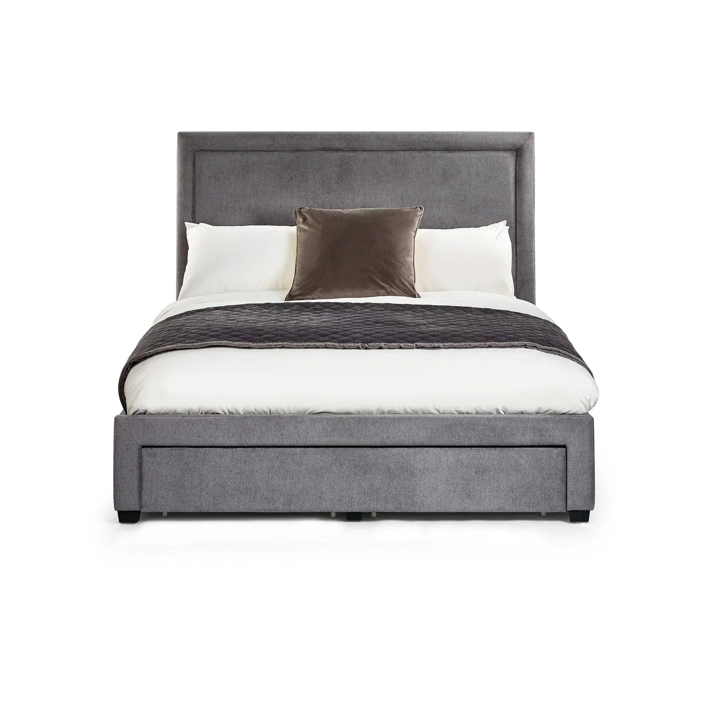 Grey upholstered bed frame with tall headboard, styled with white bedding and cushions