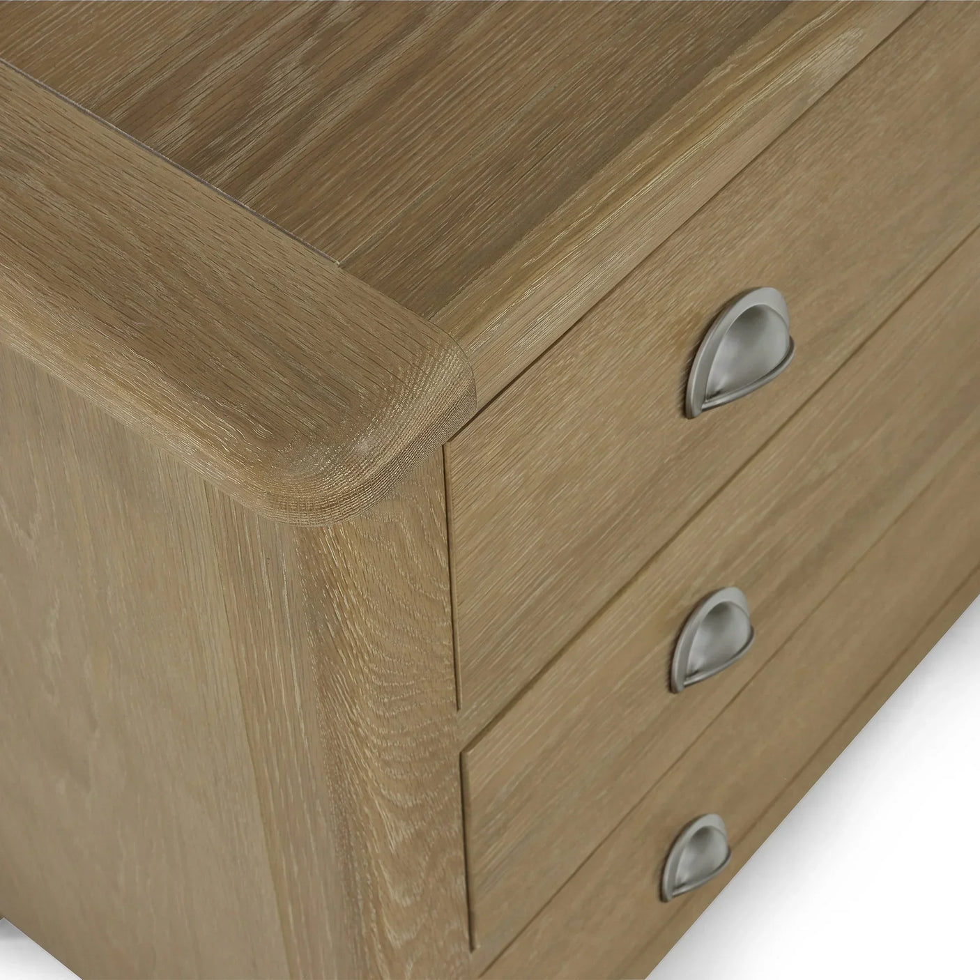 Memphis limed oak 3 drawer chest with curved edge and alternative metal cup handles