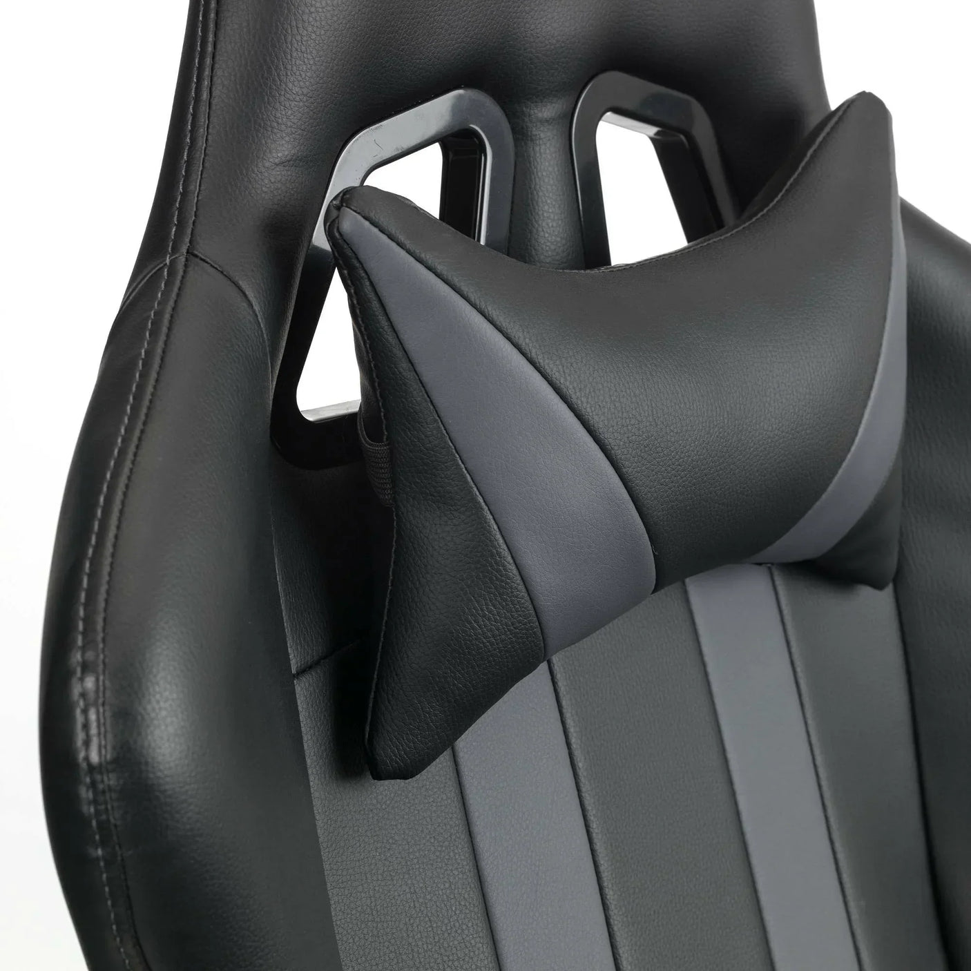 Black and grey gaming chair backrest with headrest cushion detail