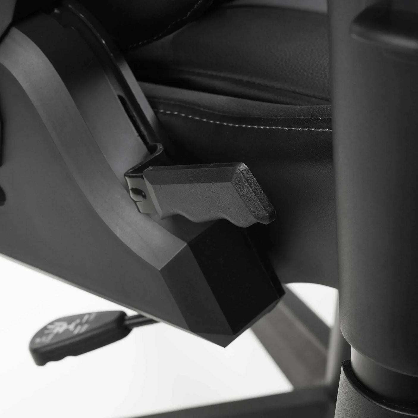 Meteor gaming chair recline adjustment lever and black leather stitching detail