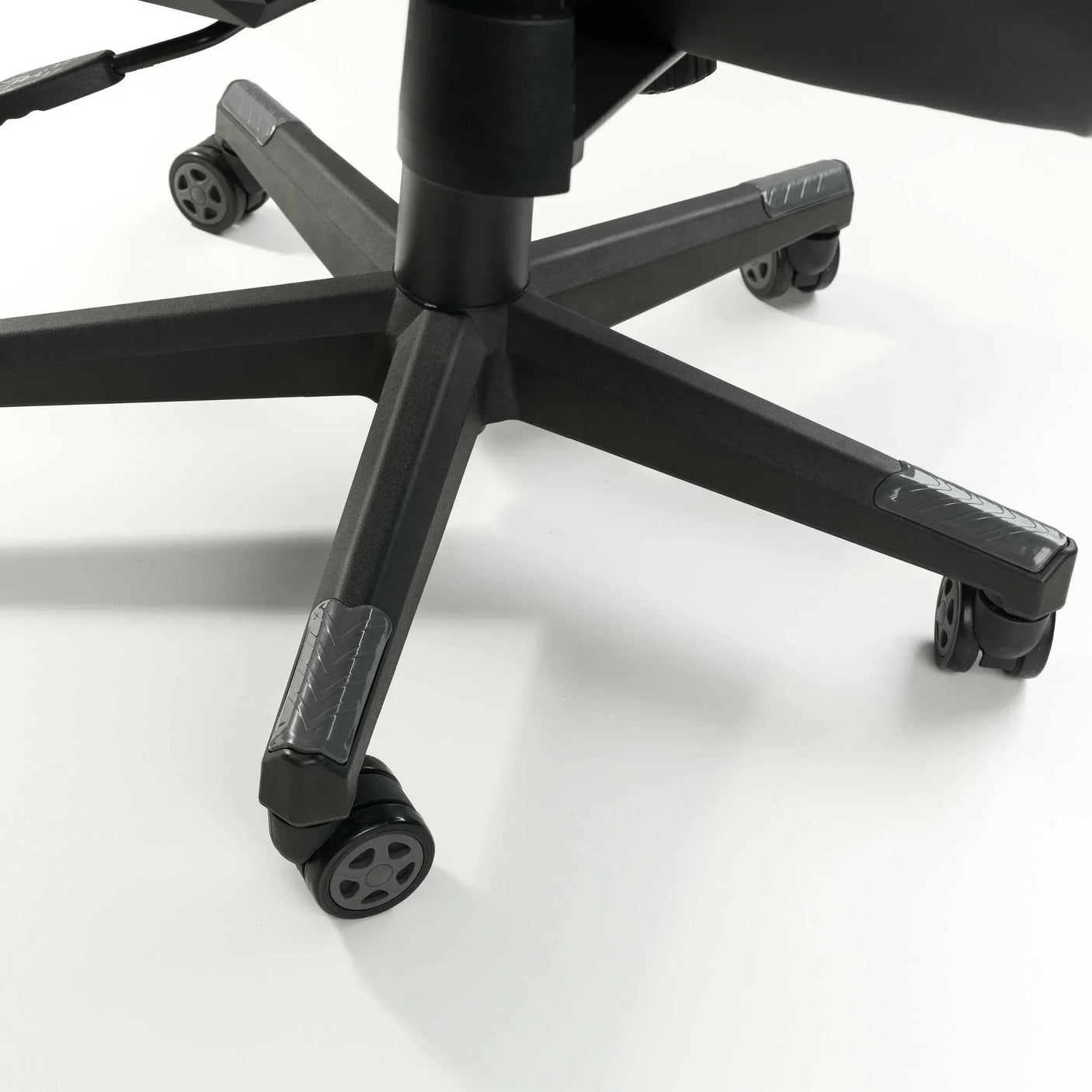 Meteor gaming chair base with five black caster wheels on white background