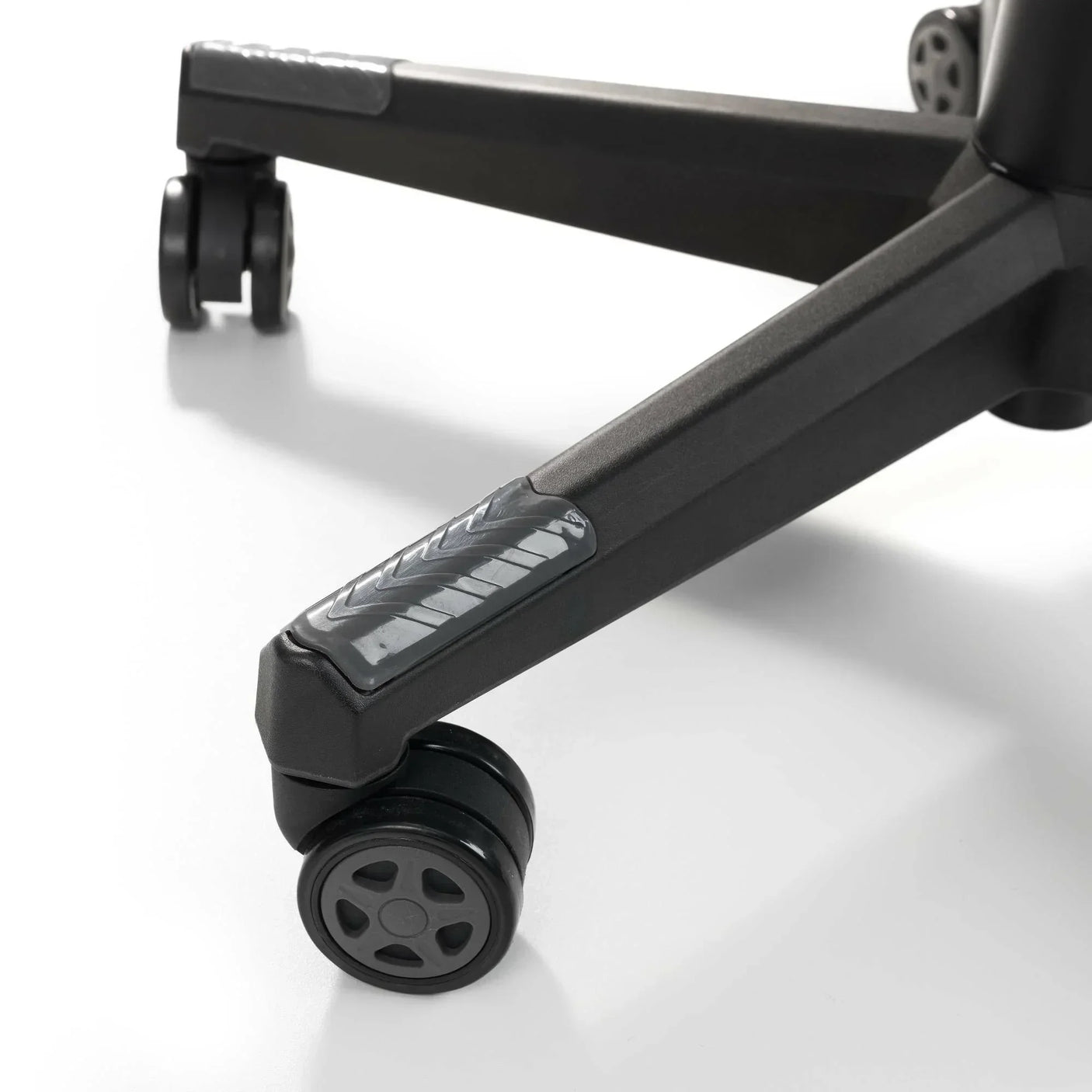 Meteor gaming chair base with black caster wheels and textured footrests