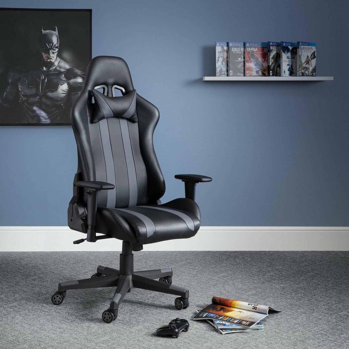 Black and grey meteor gaming chair with lumbar cushion in modern gaming room on grey carpet