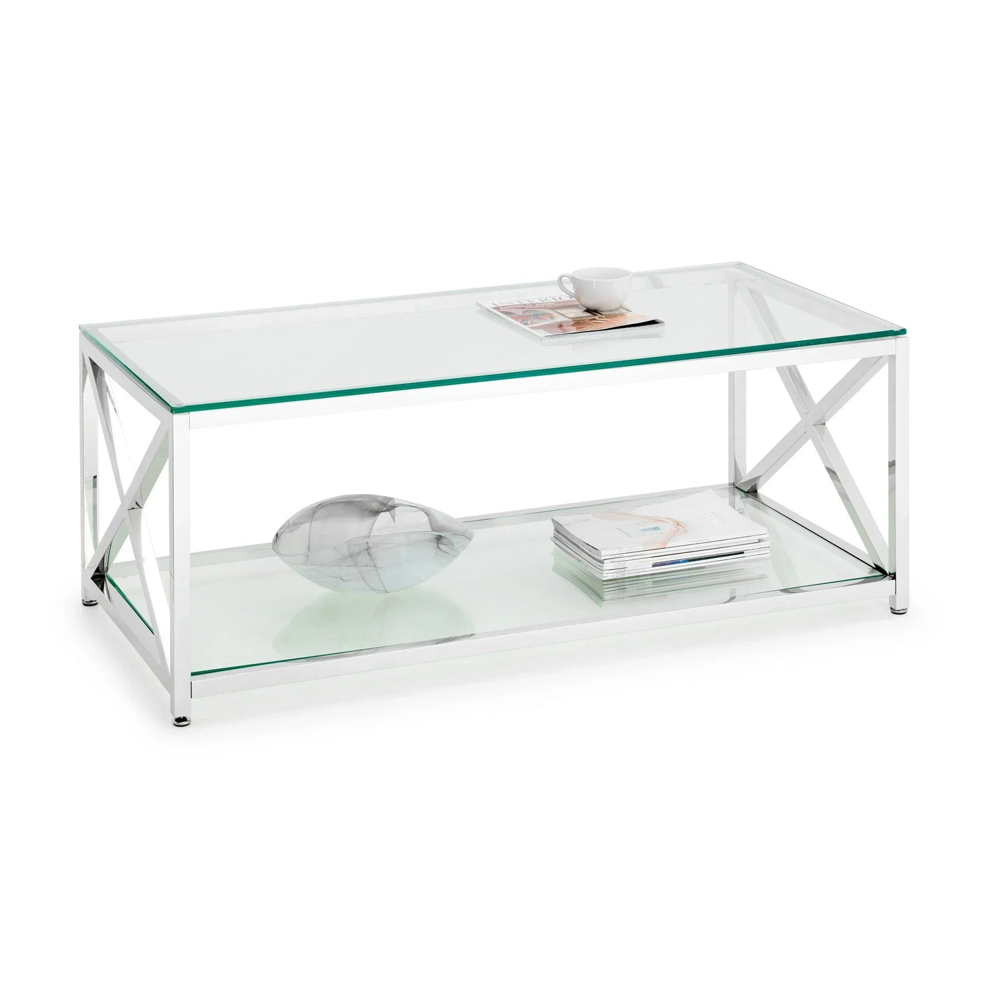 Rectangular glass coffee table with chrome frame, lower shelf holding magazines and decor