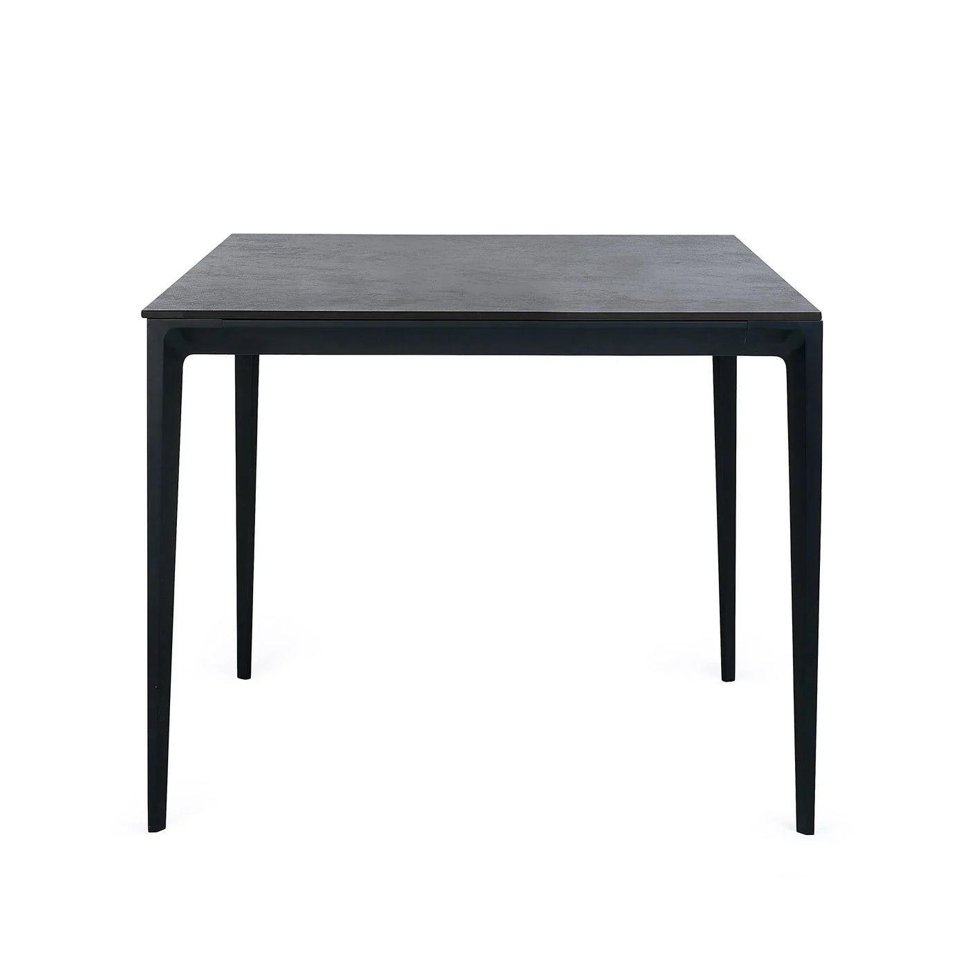 Slate grey square stone top dining table with slim black legs, front angle view