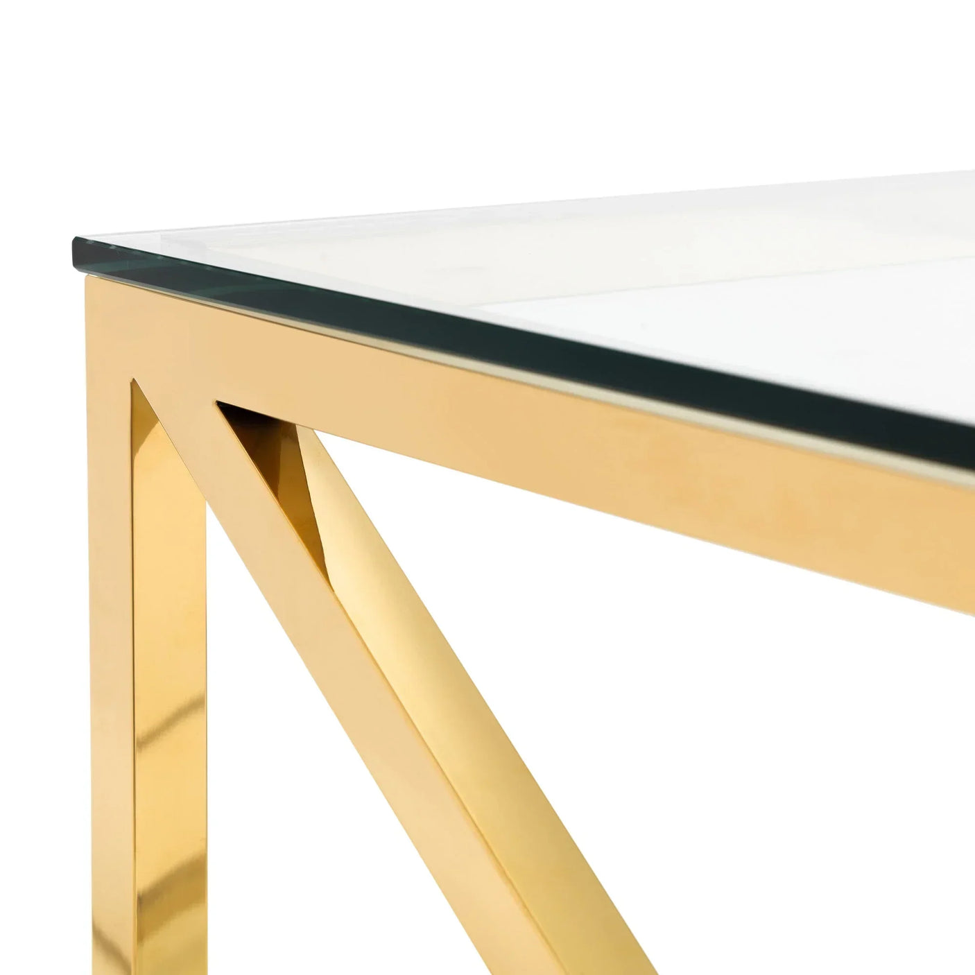 Glass top table with gold metal frame, close-up of corner and leg detail