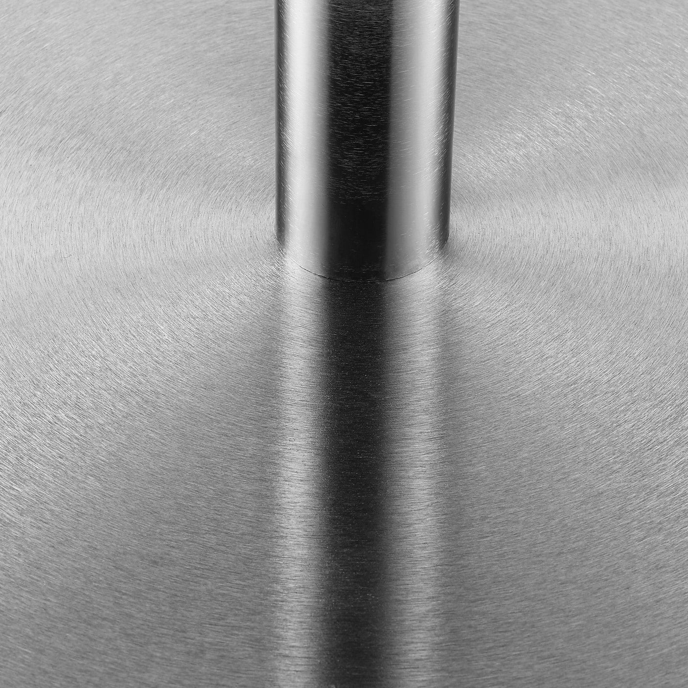 Brushed stainless steel furniture base with circular pattern and central support column