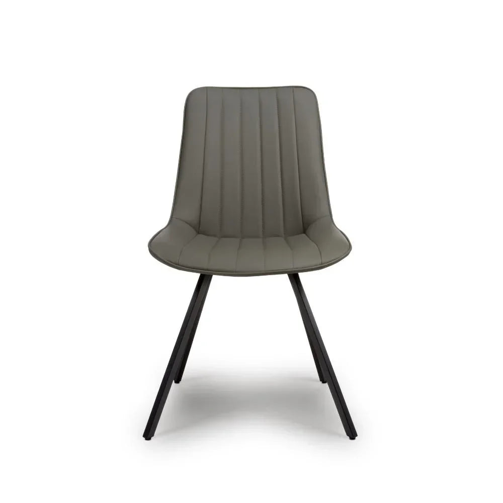 Grey faux leather dining chair with black metal legs, front view, vertical stitched detail
