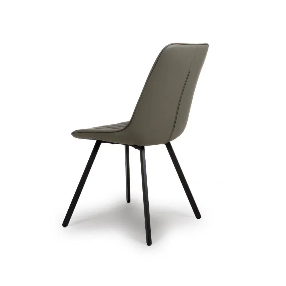 Grey dining chair with black metal legs, angled back view