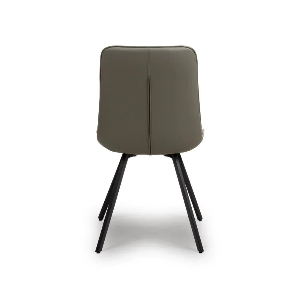Back view of grey dining chair with black angled legs on white background