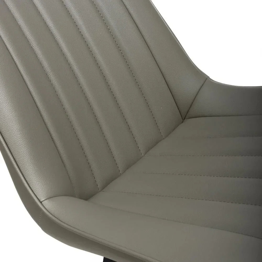 Close-up of grey faux leather dining chair seat with vertical stitched detailing