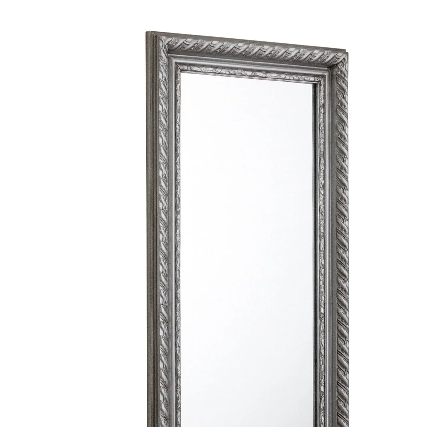 Pewter dress mirror with ornate carved frame detail, shown from a side angle
