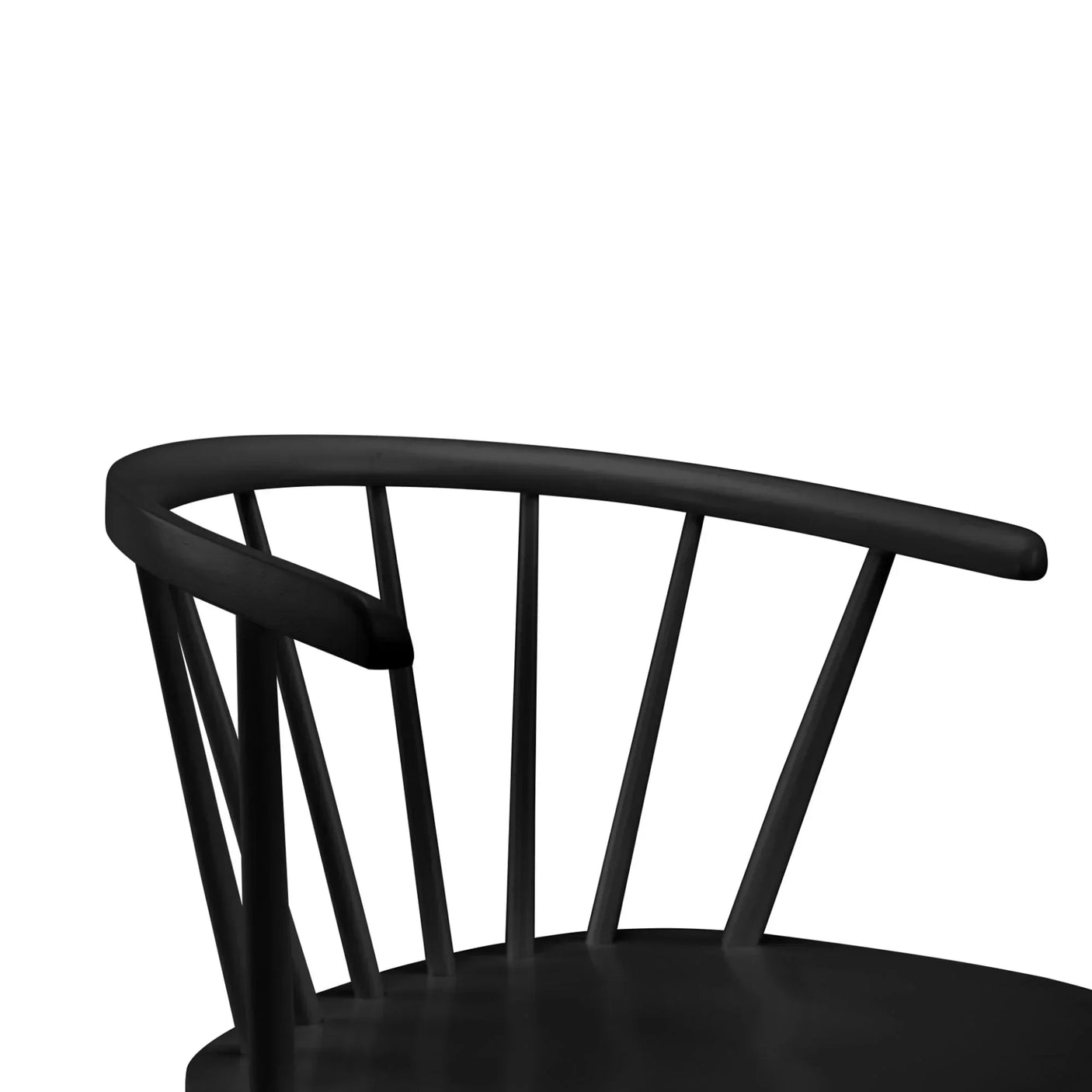 Curved backrest detail of black dining chair with vertical slats and smooth matte finish