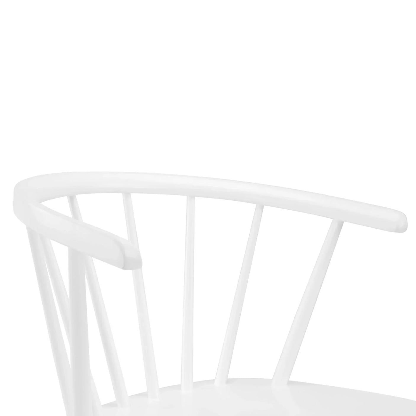 Curved back detail of white dining chair with spindle supports