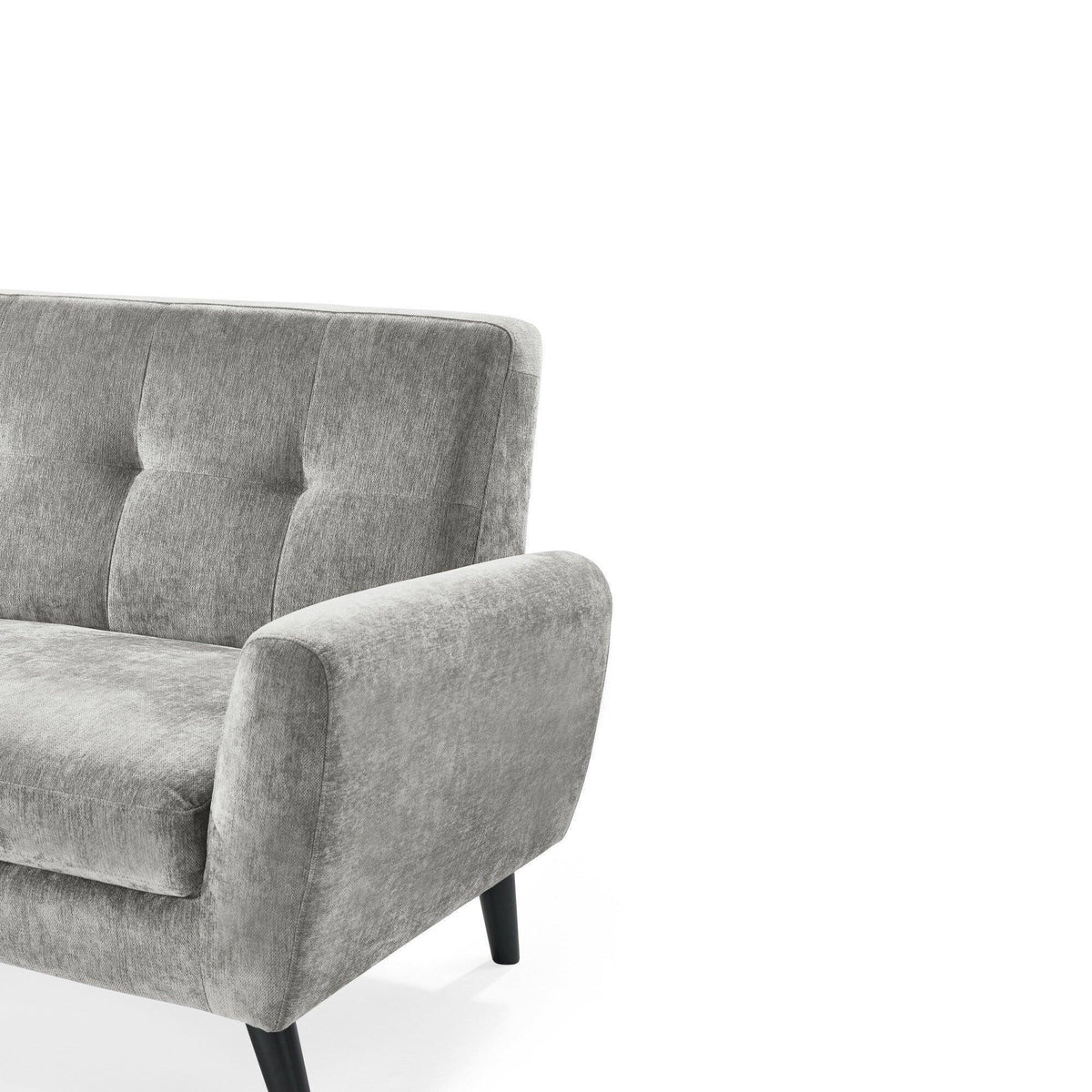 Light grey fabric sofa with tufted backrest and black wooden legs, angled side view