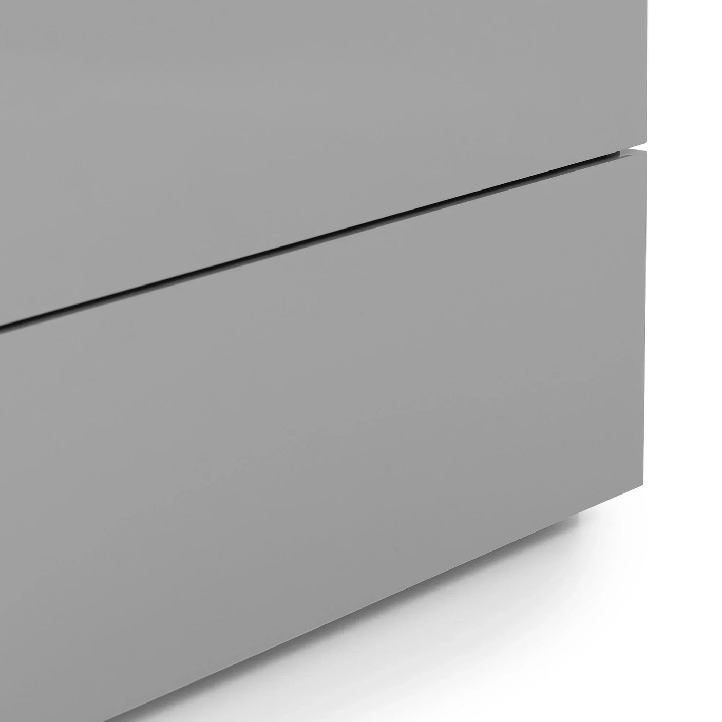 Close-up of grey gloss drawer unit corner with smooth finish and modern edge details