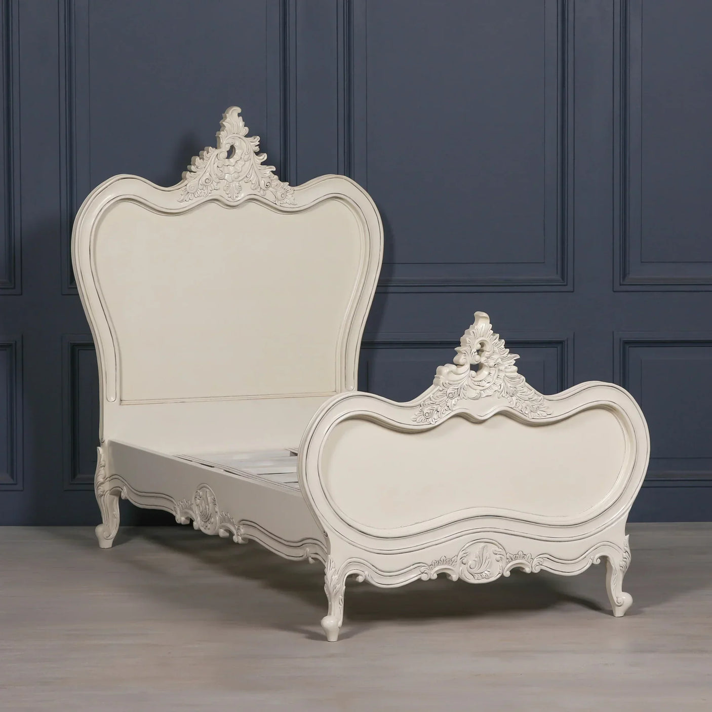 Ivory wooden bed frame with ornate carved headboard and footboard, French style design