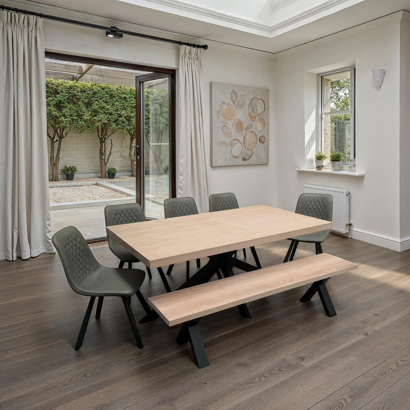Light oak dining table with bench and retro pale oyster chairs in modern dining room