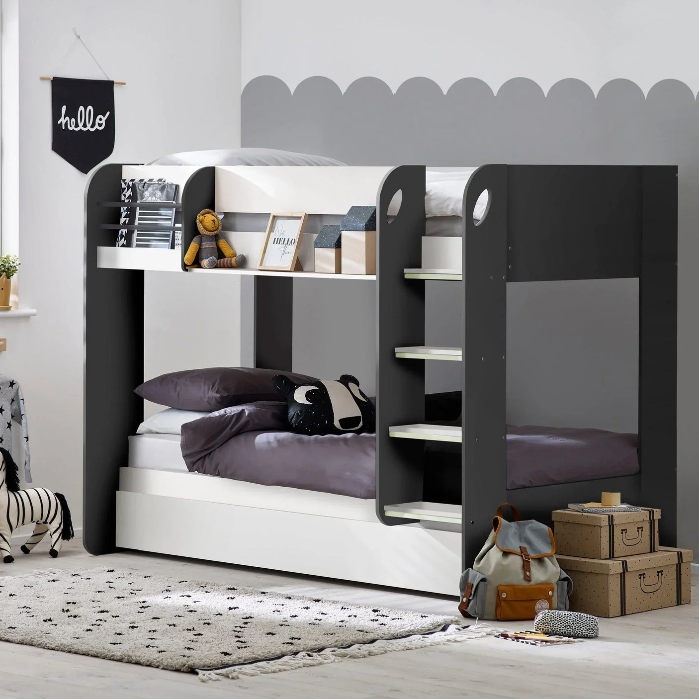 Charcoal and white bunk bed with built-in ladder in kids' bedroom, bedding and toys included