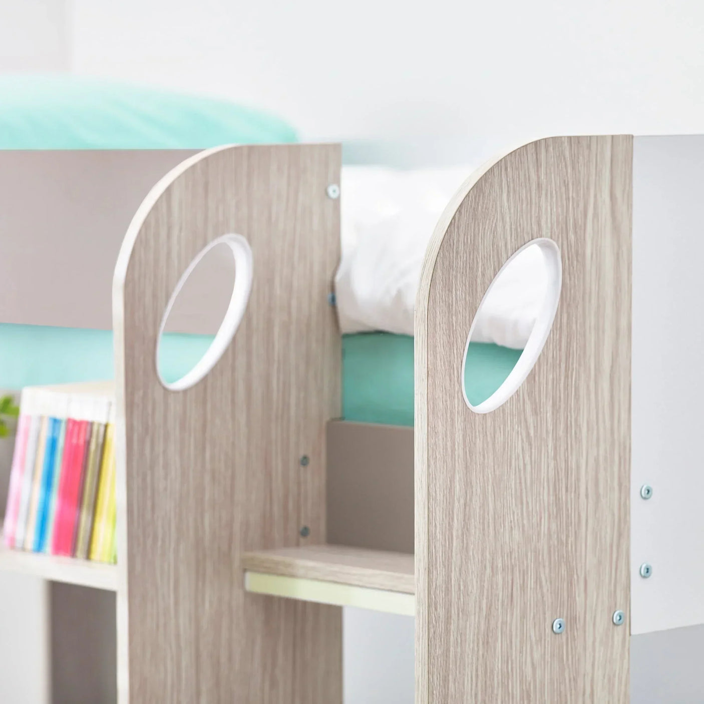 Taupe wood bunk bed ladder detail with rounded cutouts and book storage shelves