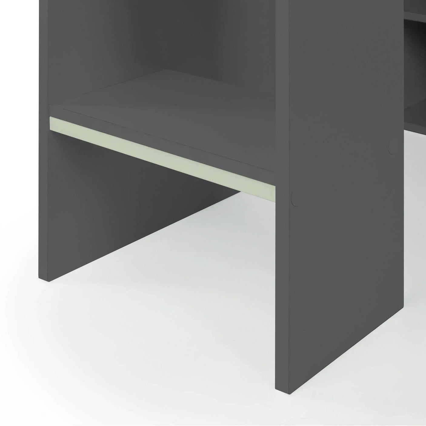 Anthracite gaming bed lower shelf close-up with matte finish and light trim detail