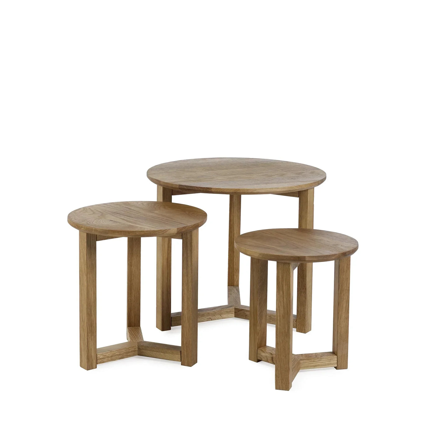 Oak nest of tables set with three round tables in natural wood finish on white background