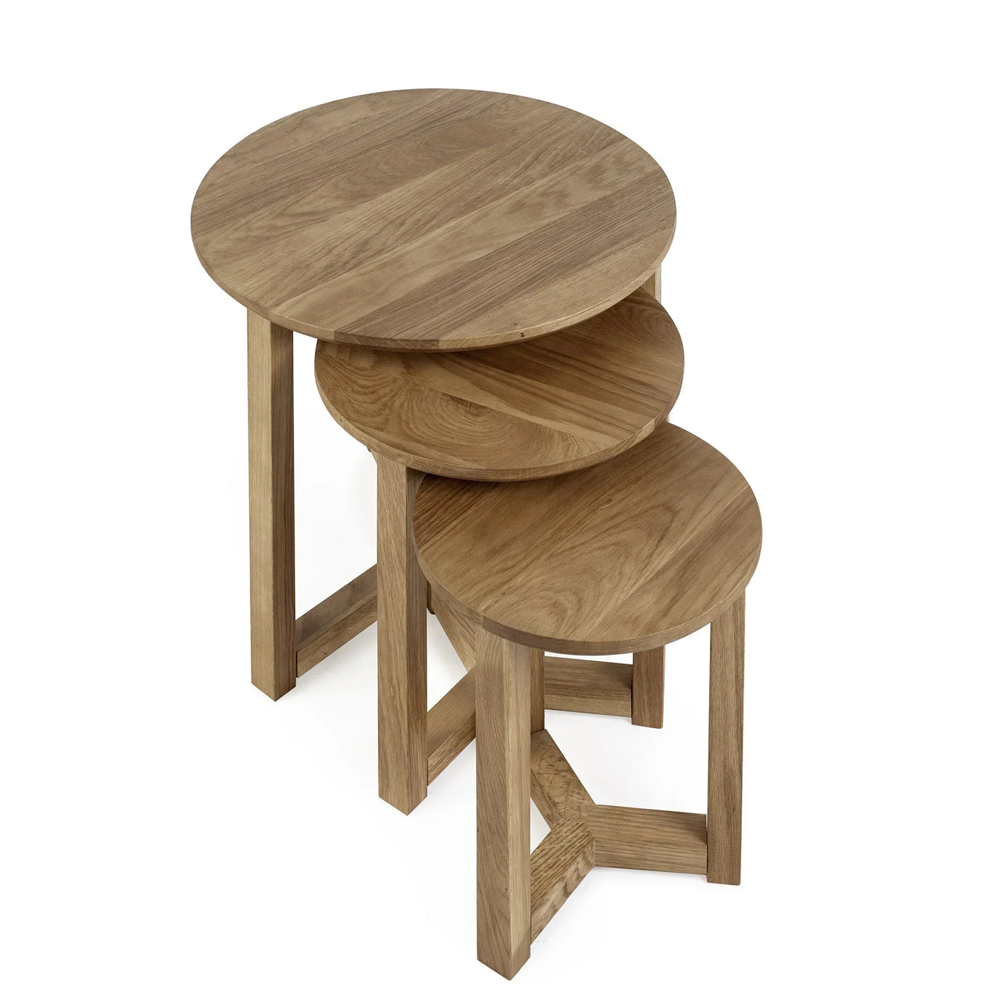 Oak nest of tables with round wooden tops, stacked to show space-saving design