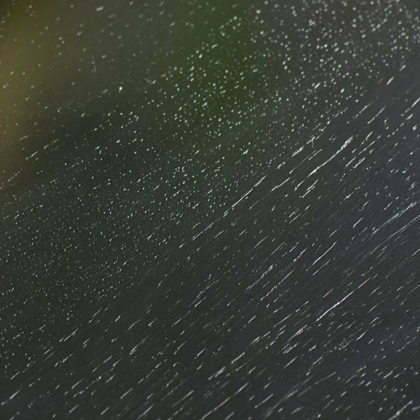 Close-up of black wooden furniture texture with visible wood grain pattern