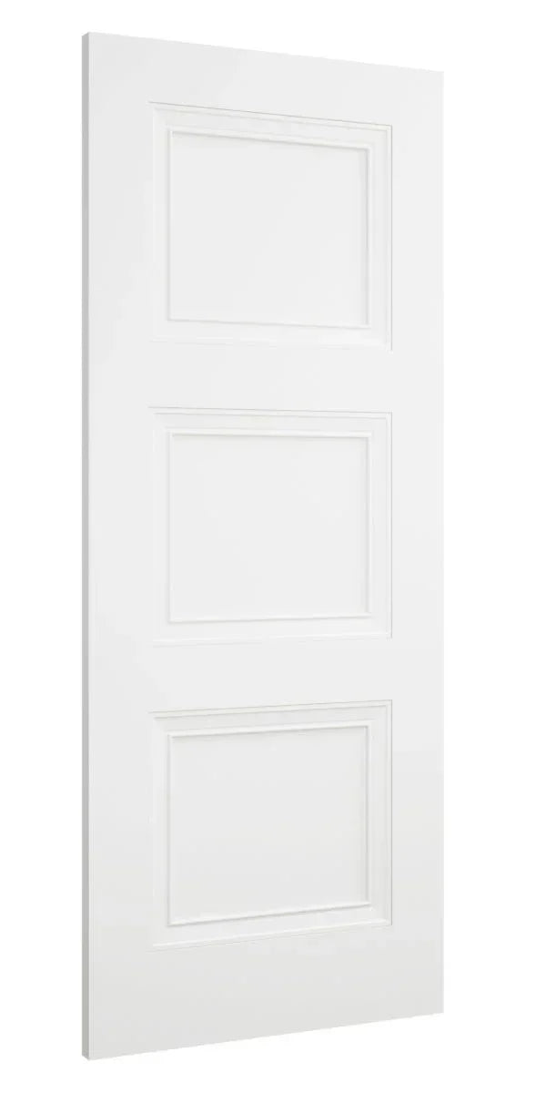 White interior door with three rectangular panels, solid wood, side angle view