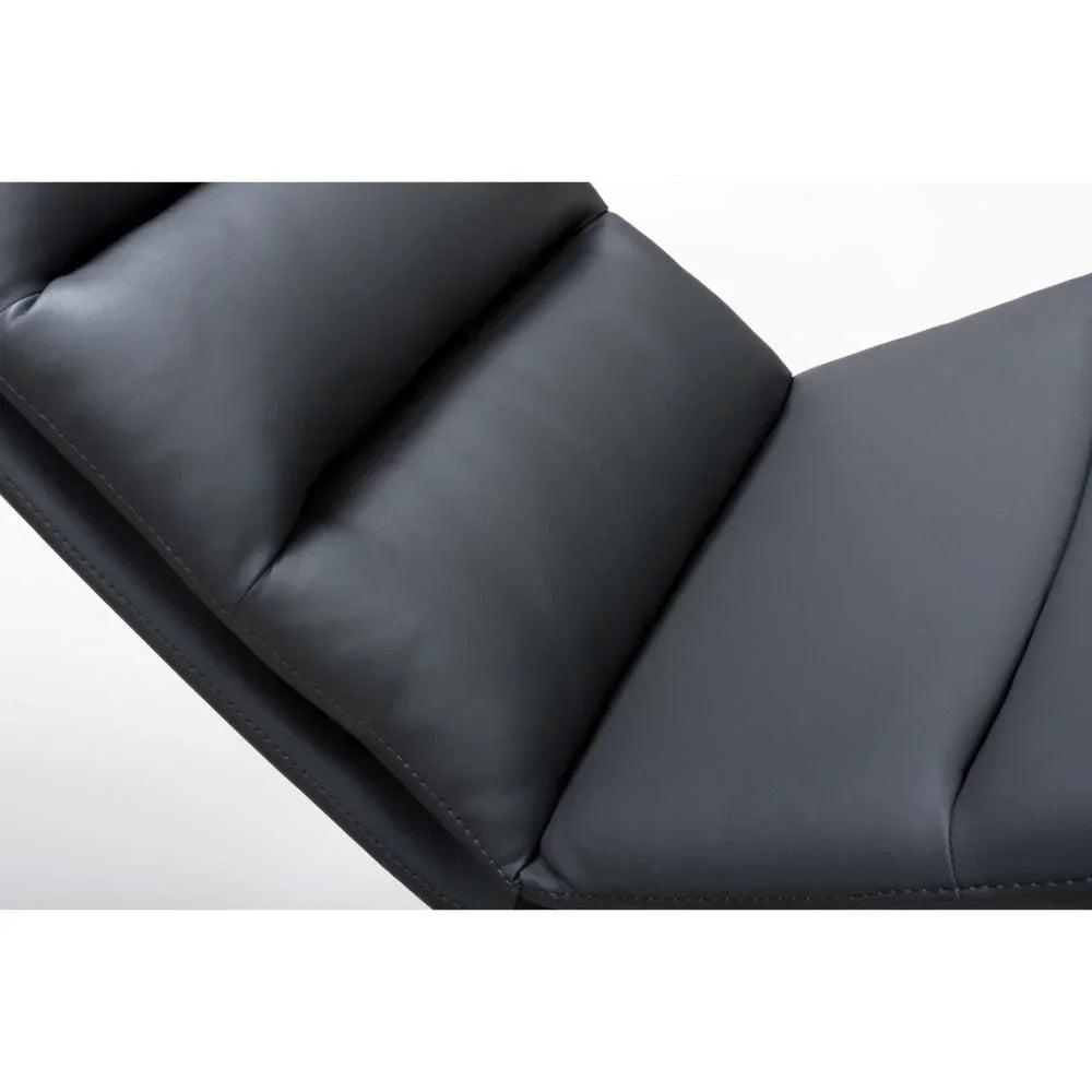 Close-up of black leather recliner chair cushions with stitched detail