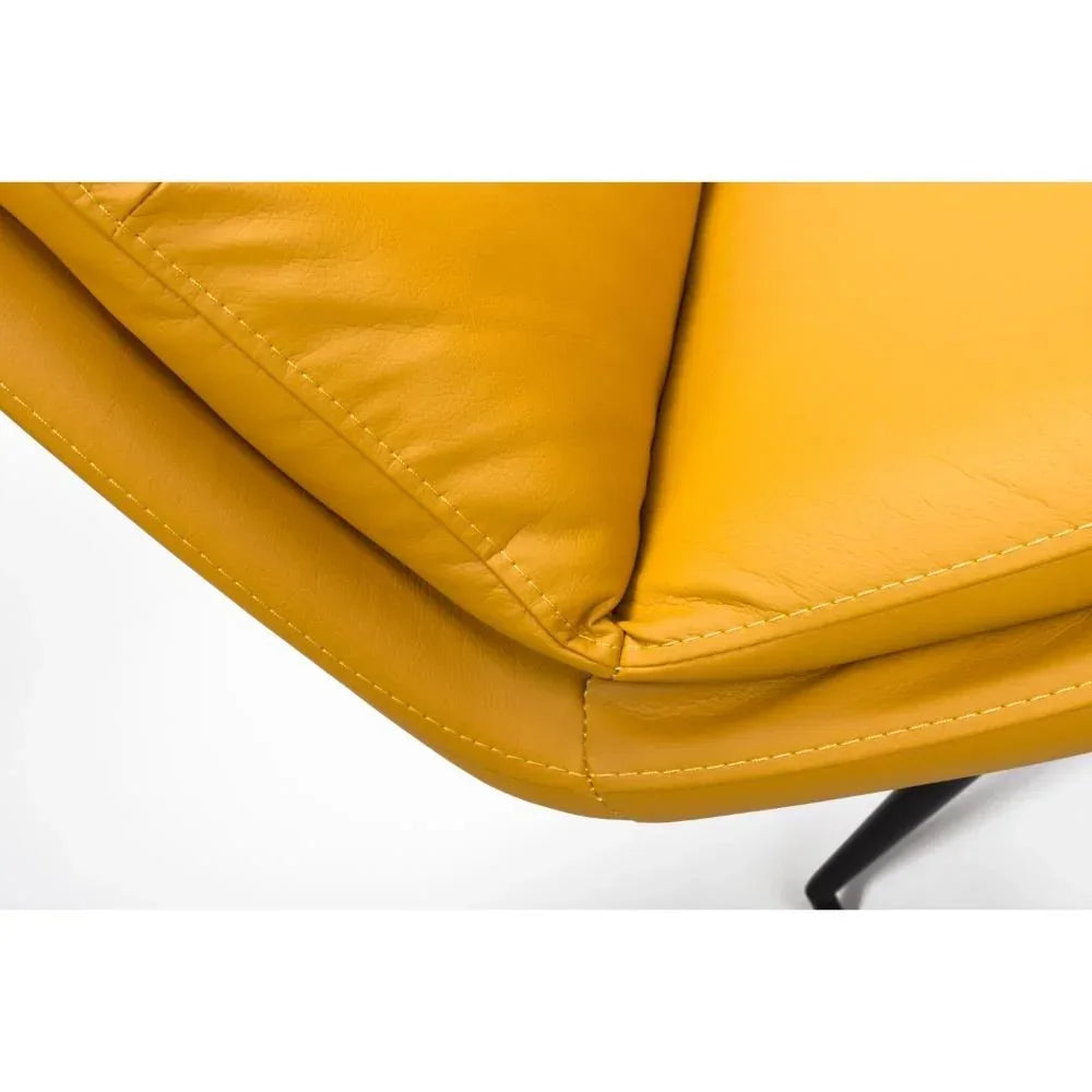 Yellow leather sofa upholstery close-up with visible stitching and angled metal leg