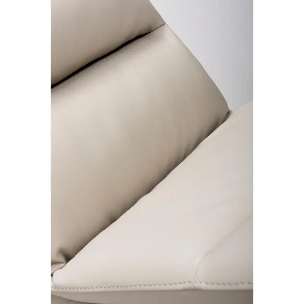 Close view of beige leather sofa cushion with detailed stitching