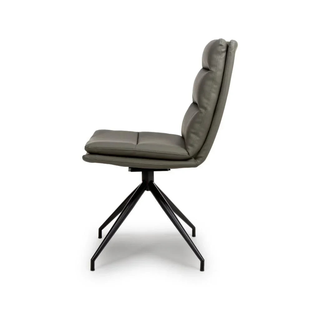 Grey leather dining chair with padded seat and black metal legs side view