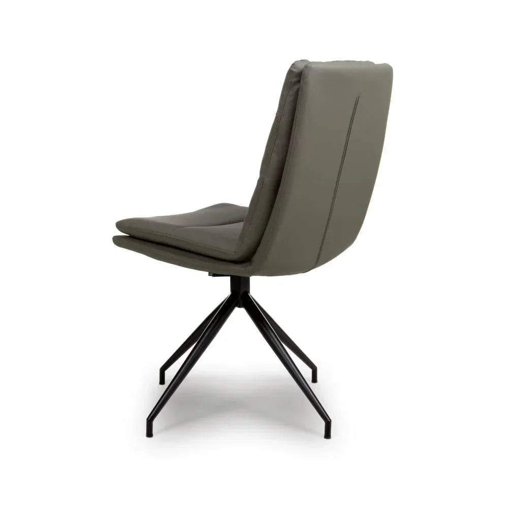 Grey dining chair with padded seat and black metal legs, side angle view