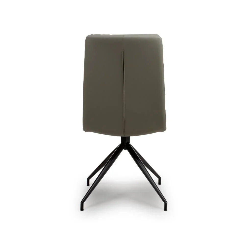 Rear view of modern dining chair with dark faux leather and black metal legs