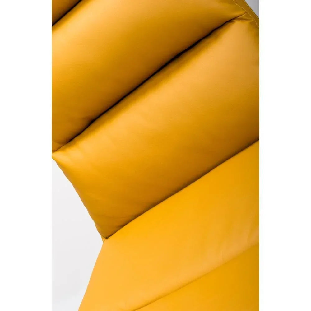 Close view of mustard yellow leather sofa backrest with deep padded sections
