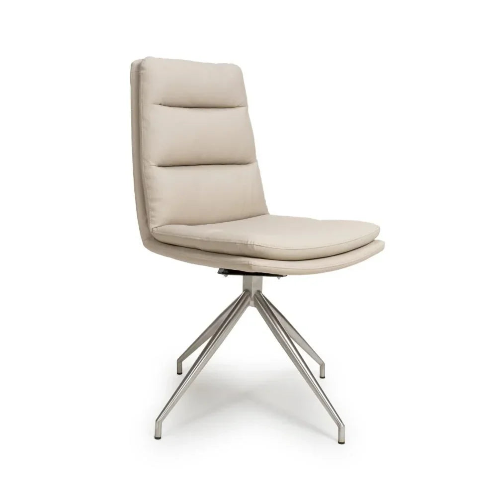 Beige dining chair with padded seat and metal swivel base, angled side view