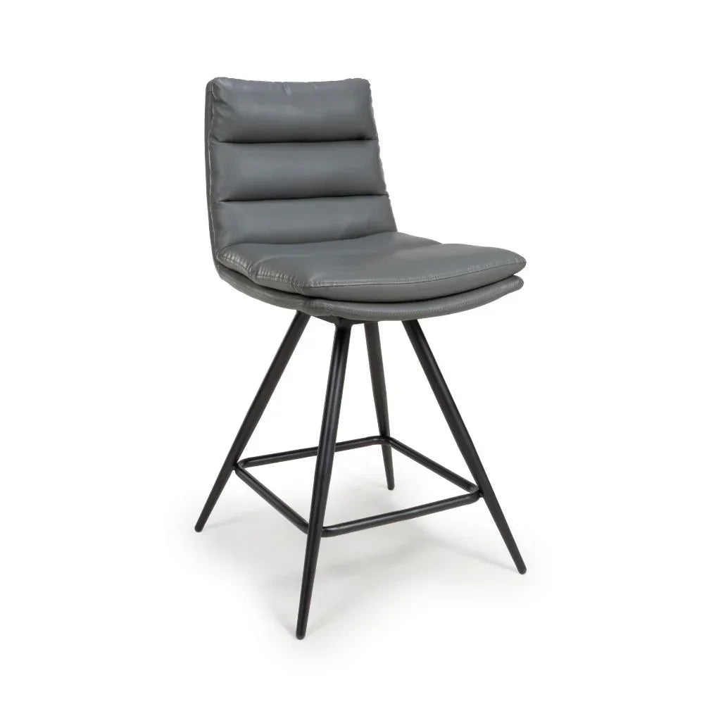 Grey faux leather bar stool with padded seat and black metal legs, angled front view