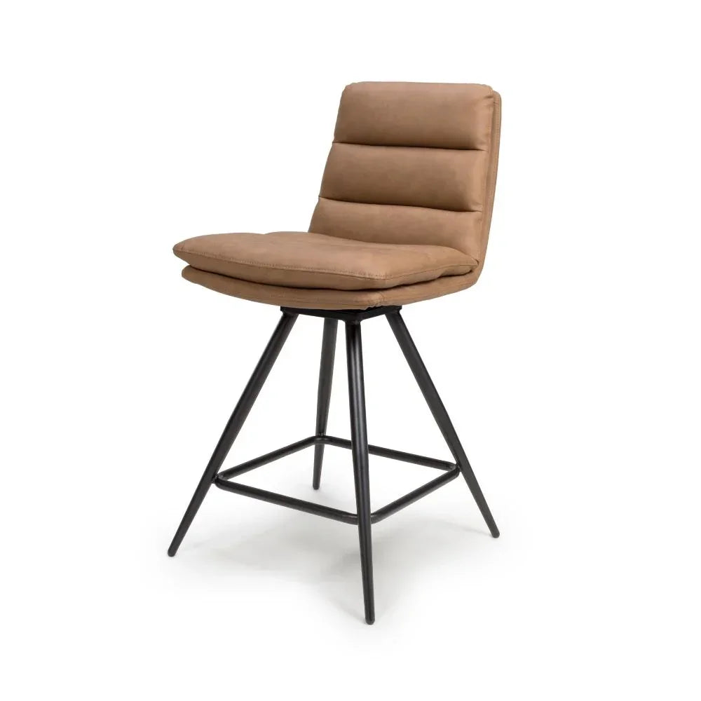 Tan faux leather bar stool with padded seat and black metal legs