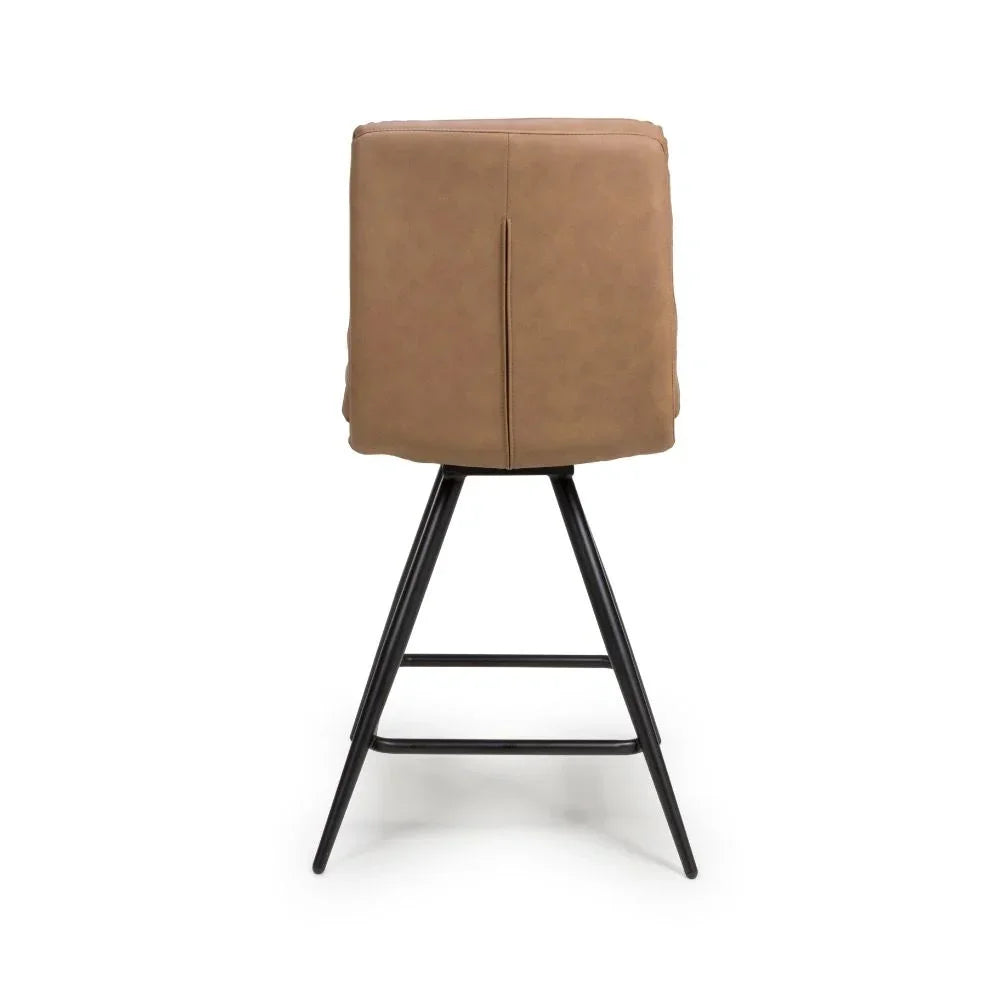 Tan faux leather bar stool with black metal legs, rear view emphasizing padded backrest