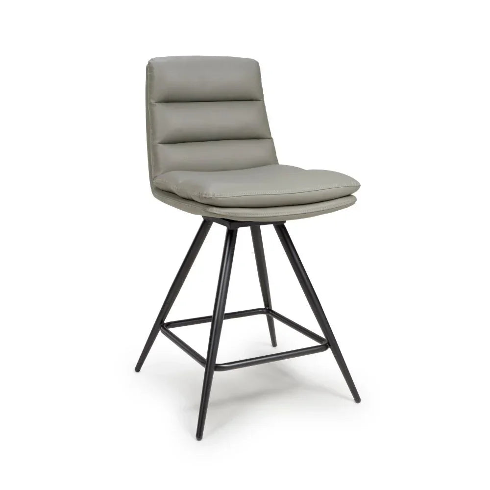 Grey padded bar stool with metal legs and horizontal stitching on seat and backrest