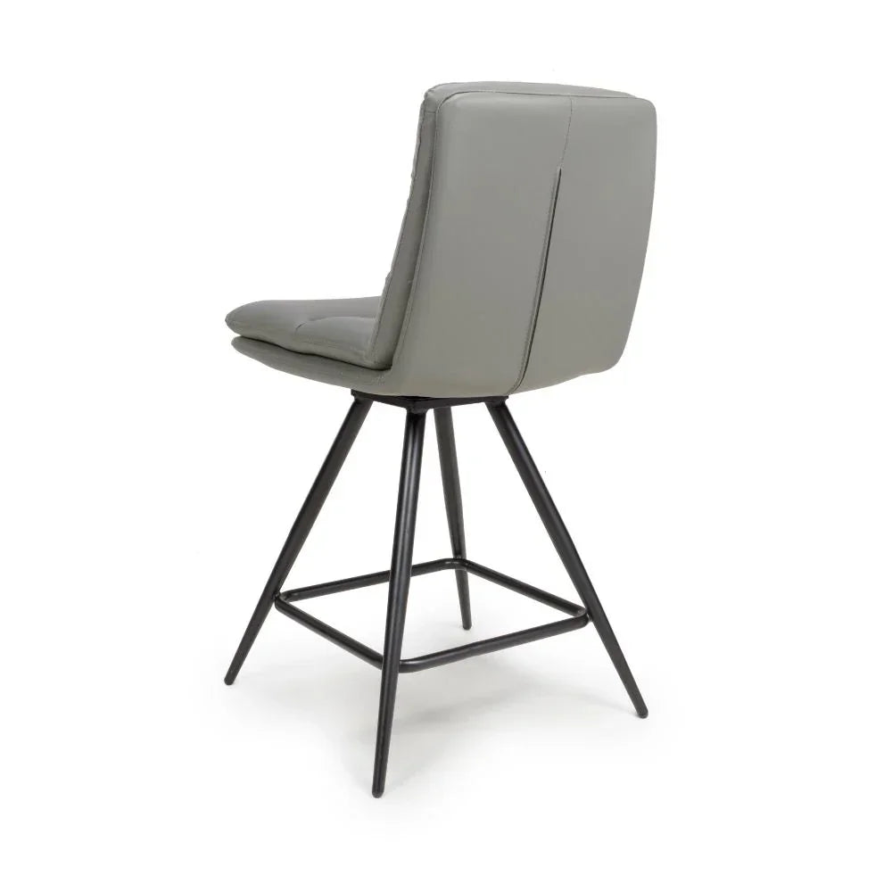 Grey faux leather bar stool with padded seat and black metal legs, rear angle view
