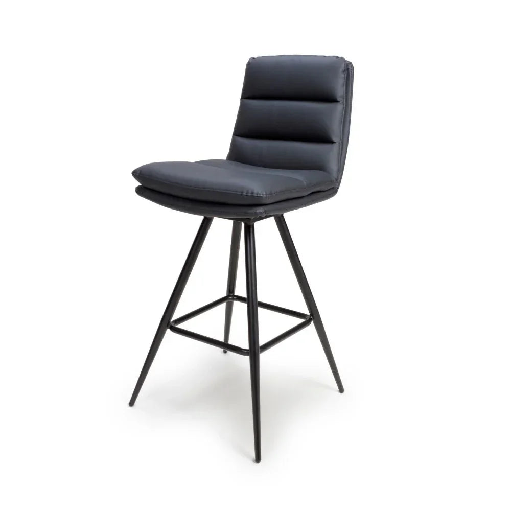 Black bar stool with padded seat and backrest on metal legs, side angle view