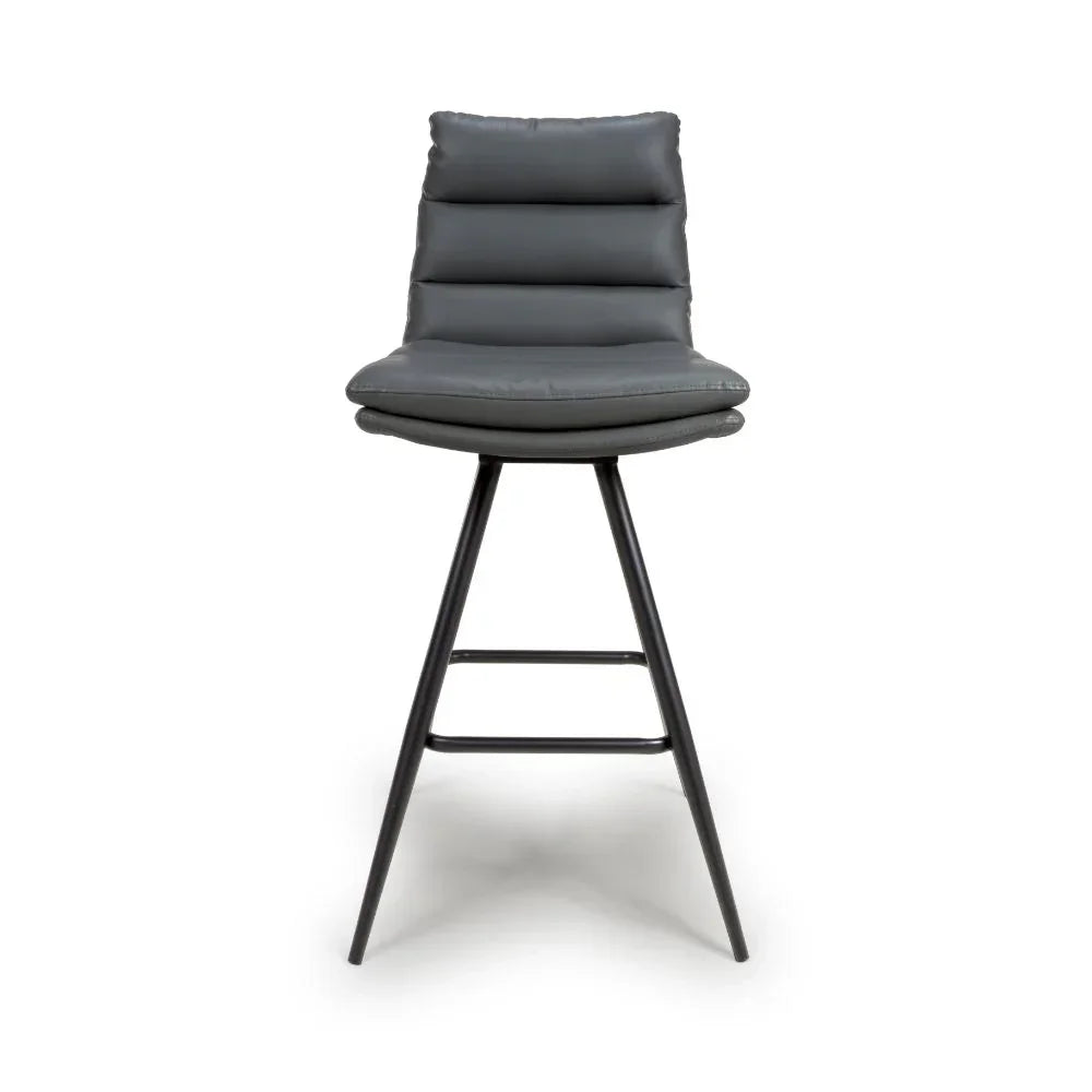 Grey padded bar stool with metal legs and horizontal stitched backrest, front view