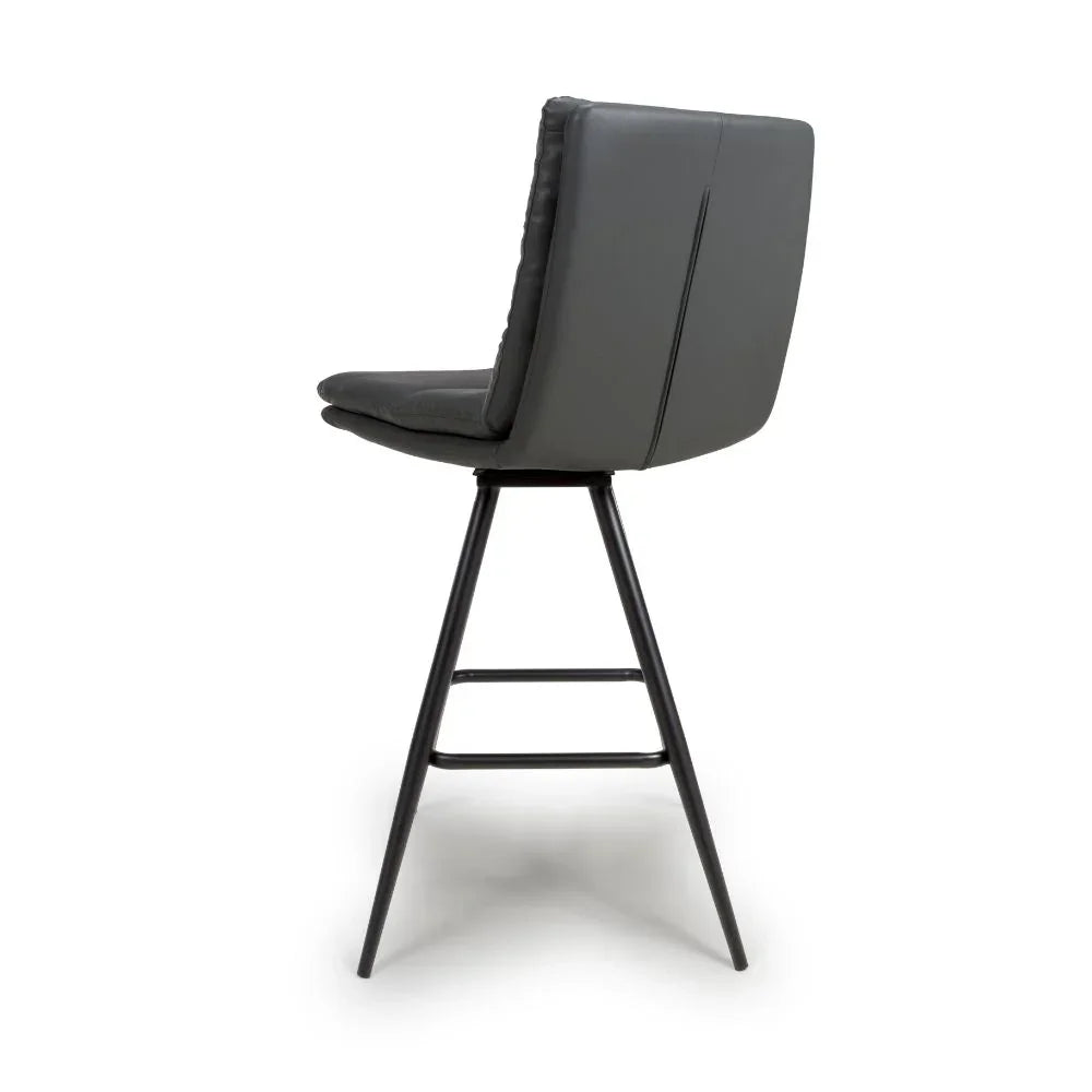 Grey bar stool with padded seat, high backrest, and black metal legs side view