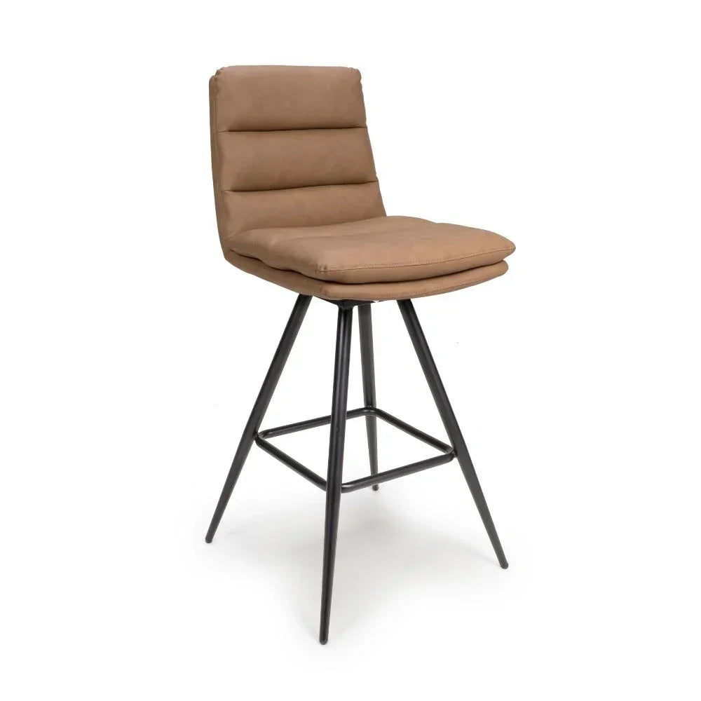 Tan faux leather bar stool with padded seat and black metal legs